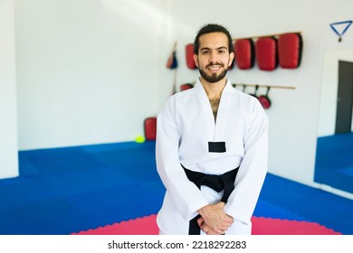 Handsome Latin Advanced Student Smiling While Ready For A Taekwondo Practice