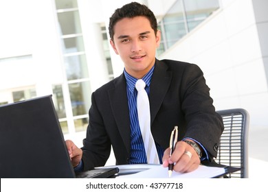 Handsome Latino Business Man At Office Working