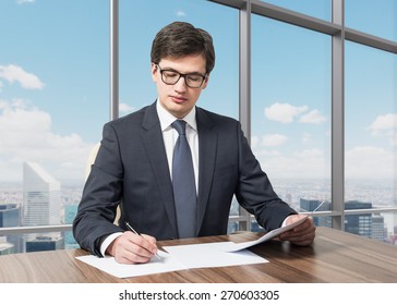 Handsome Legal Consultant Is Dealing With Due Diligence Process In A Modern Skyscraper Office With A Panoramic New York View.