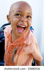 A Handsome Little African American Boy Smiling For The Camera