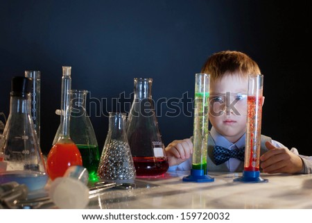 Similar – Image, Stock Photo Happy kid looking liquid through magnifying glass