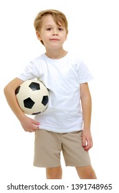 Handsome Little Boy In A Pure White T-shirt Playing With A Soccer Ball. On The T-shirt, You Can Make An Advertising Inscription Of A Football Club, Or Apply Any Other Inscription. Isolated On White