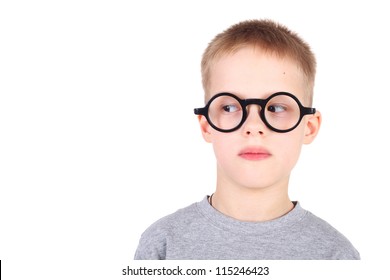 handsome little boy in the round glasses looking to the left