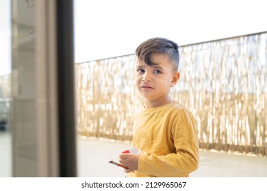 Handsome Little Hispanic Boy Crying At Home, Tears