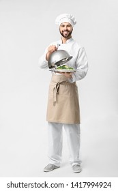 Handsome Male Chef With Salad On White Background