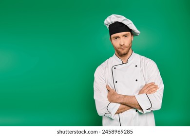 Handsome male chef in white uniform standing with arms crossed. - Powered by Shutterstock