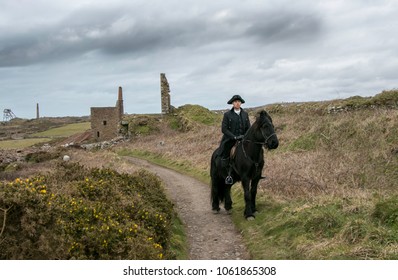 Handsome Male Horse Rider Regency 18th Century Poldark Costume with tin mine ruins and countryside in background