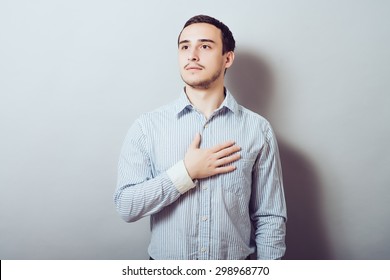 Handsome  Male Resting Hands On His Chest