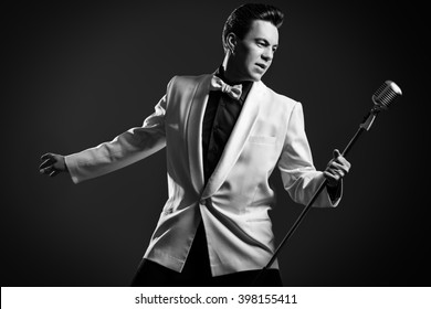 Handsome male singer, who plays in the style of the sixties. Rock'n'roll, jazz man. Nostalgia.