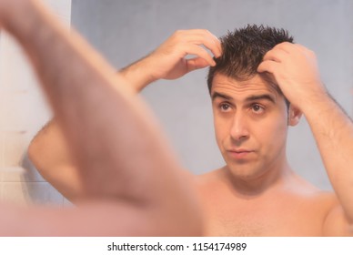 Handsome Man Applying Hair Gel 