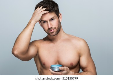 Handsome Man Applying Hair Gel
