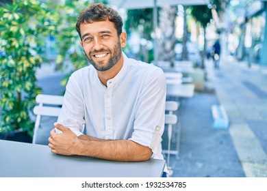 Handsome man with beard wearing casual white shirt on a sunny day smiling happy outdoors - Powered by Shutterstock