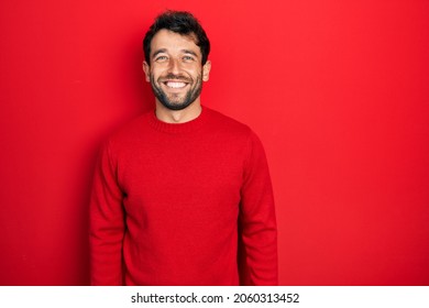 Handsome Man With Beard Wearing Casual Red Sweater With A Happy And Cool Smile On Face. Lucky Person. 