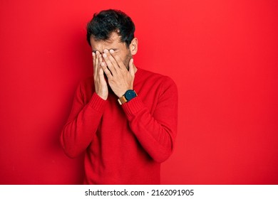 Handsome Man With Beard Wearing Casual Red Sweater Rubbing Eyes For Fatigue And Headache, Sleepy And Tired Expression. Vision Problem 