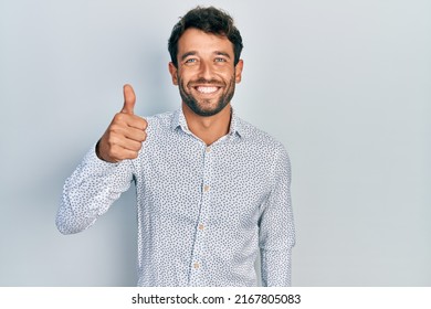 Handsome Man With Beard Wearing Casual Elegant Shirt Smiling Happy And Positive, Thumb Up Doing Excellent And Approval Sign 