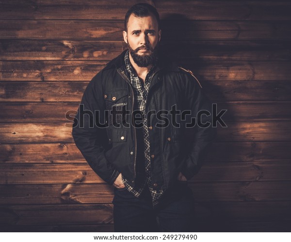 Handsome man\
with beard  wearing waxed canvas jacket\
