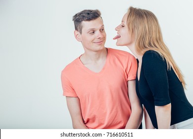 Handsome Man With Beautiful Sexy Woman Licking Man Cheek.