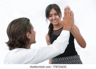 Handsome Man And Beautiful Woman Giving Hi Five