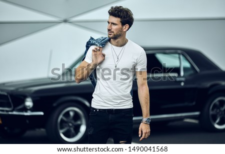 Handsome man with black classic car wear smart casual 