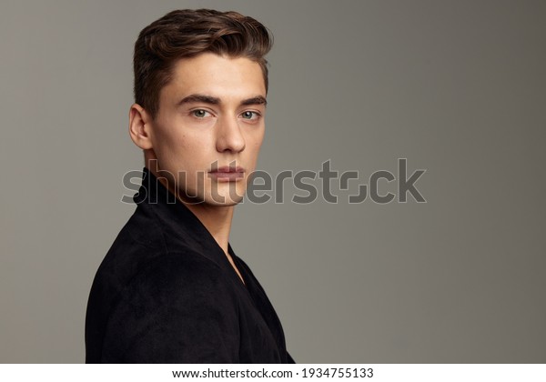 handsome man black jacket fashion hairstyle\
close-up attractive look\
model