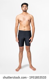 Handsome man in black swim shorts summer fashion full body