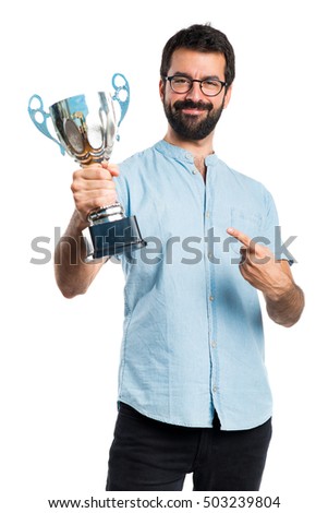 Handsome man with blue glasses holding a trophy