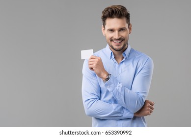 Handsome Man In Blue Shirt  With White Card