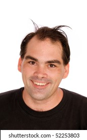 A Handsome Man With Brown Hair And Eyes Is Smiling At Viewer With Silly Hairdo Looking Like He Has Horns