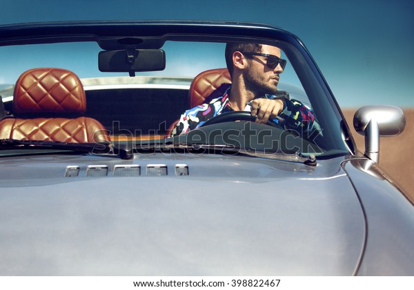 Handsome man in the car.\
Luxury life.