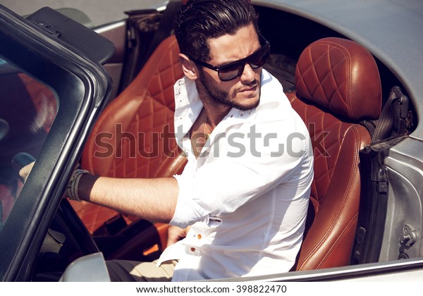 Handsome man in the car.\
Luxury life.