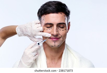 Handsome Man With Closed At Plastic Surgery With Syringe In His Face