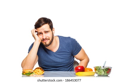 Handsome Man Craving After Junk Food Instead Of Eating Healthy Food, Isolated