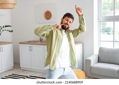 Handsome Man Dancing In Kitchen