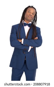 Handsome man with dreadlocks doing different expressions in different sets of clothes: arms crossed