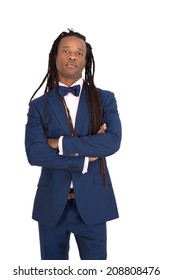 Handsome man with dreadlocks doing different expressions in different sets of clothes: arms crossed