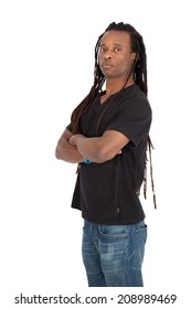 Handsome man with dreadlocks doing different expressions in different sets of clothes: arms crossed