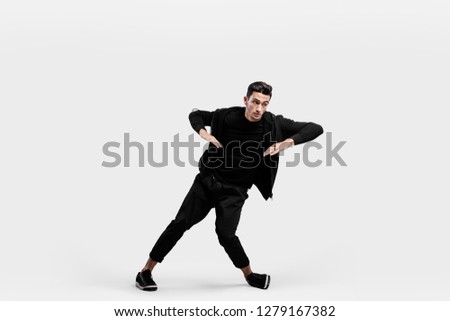 Similar – Young bearded man jumping in urban street