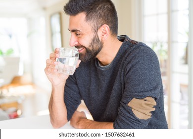 Handsome man drinking a fresh glass of water
