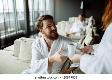 Handsome man drinking tea in morning resting room