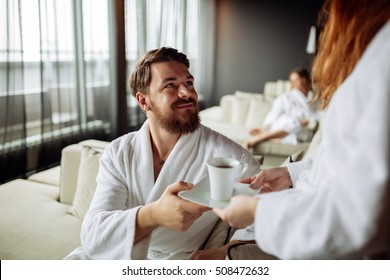 Handsome man drinking tea in morning resting room