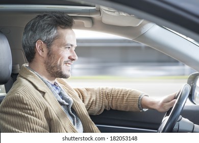 Handsome Man Driving A Car