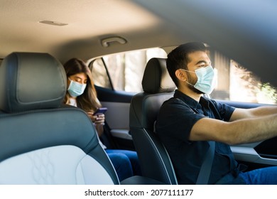 Handsome Man Driving A Car And Working As A Rideshare Driver During The Coronavirus Pandemic 