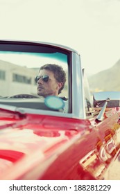 Handsome Man Driving A Convertible Car