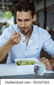 Handsome Man Eating Pasta