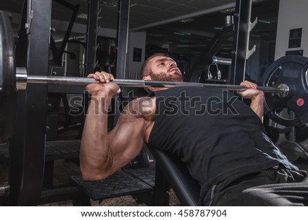 Handsome man exercise in gym.