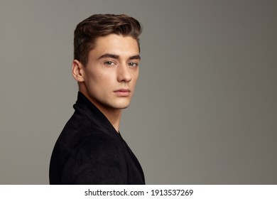 Handsome man fashionable hairstyle attractive look closeup in modern style model