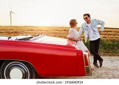 Handsome man flirting a woman during a car trip                               