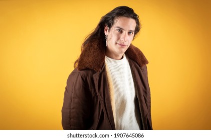 Handsome Man With Folded Hands, Casual Clothes, Very Long Hair, Yellow Background