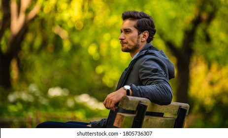 A handsome man in a forest thinking - Powered by Shutterstock