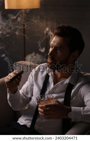 Similar – Image, Stock Photo Businessman smoking cigar in street cafe